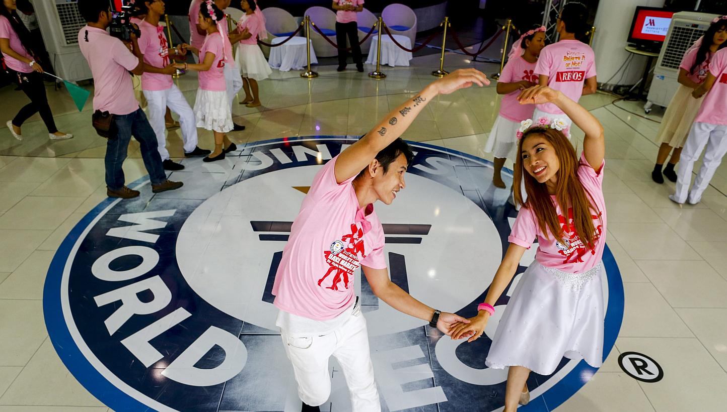 Couples dancing during a Guinness World record attempt for the Ripley's Believe It or Not! world's longest dance marathon in Pattaya, Thailand, on Feb 14, 2015. -- PHOTO: EPA
