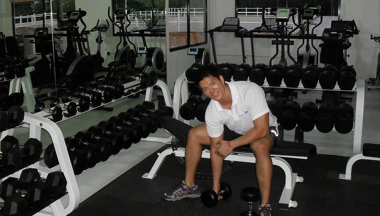 Lifting weights at his first gym, Unleash Fitness, in 2009.&nbsp;--&nbsp;PHOTO: COURTESY OF CHUNG TZE KHIT