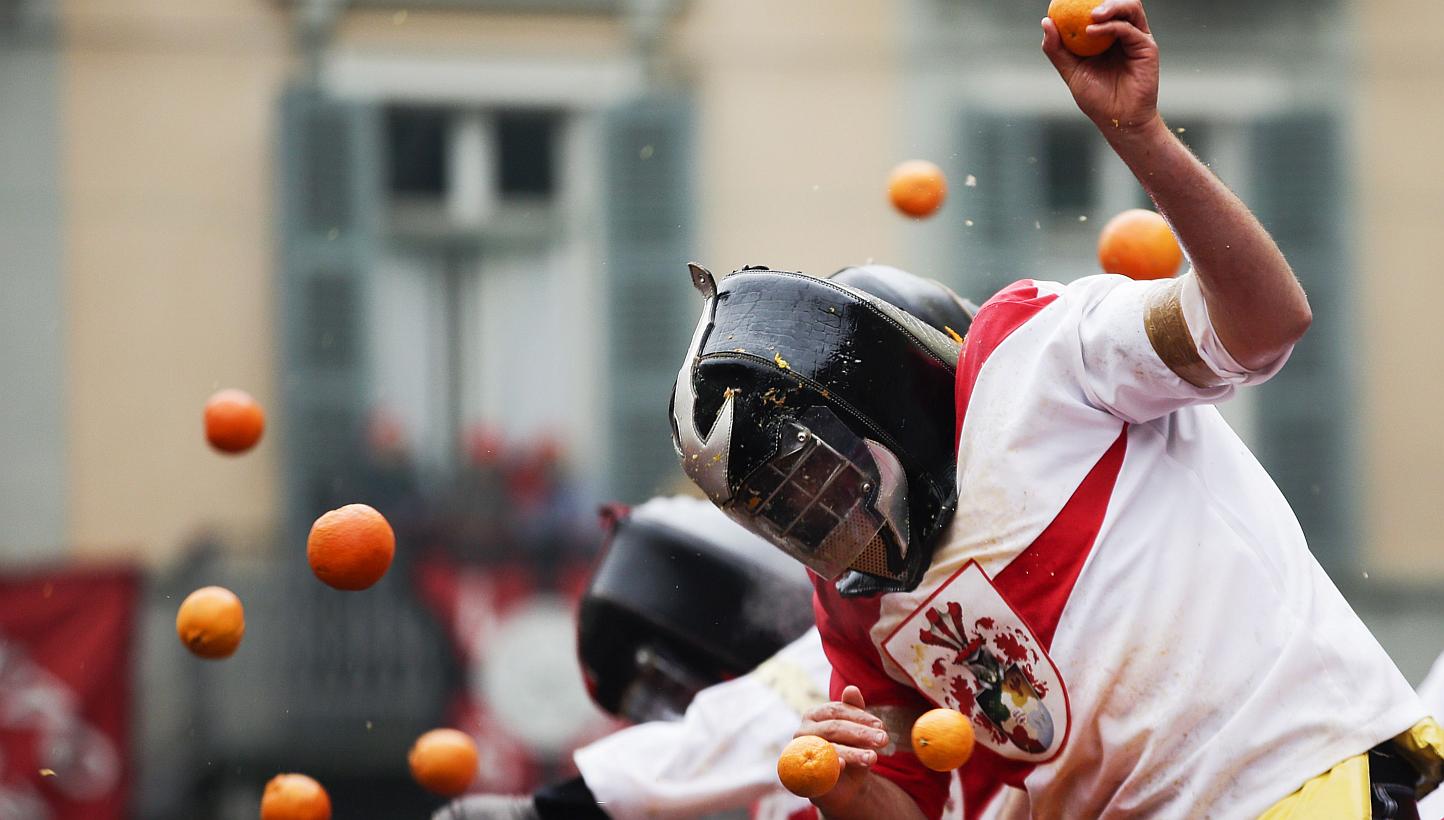 Members of rival teams fight with oranges during an annual carnival battle in the northern Italian town of Ivrea on Feb 15, 2015. -- PHOTO: REUTERS