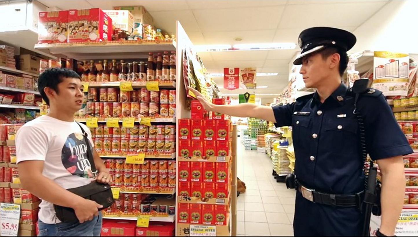 Assistant Superintendant Ryan Koh of the Singapore Police Force in his own crime prevention music video. -- SCREENGRAB: FACEBOOK / SINGAPORE POLICE FORCE
