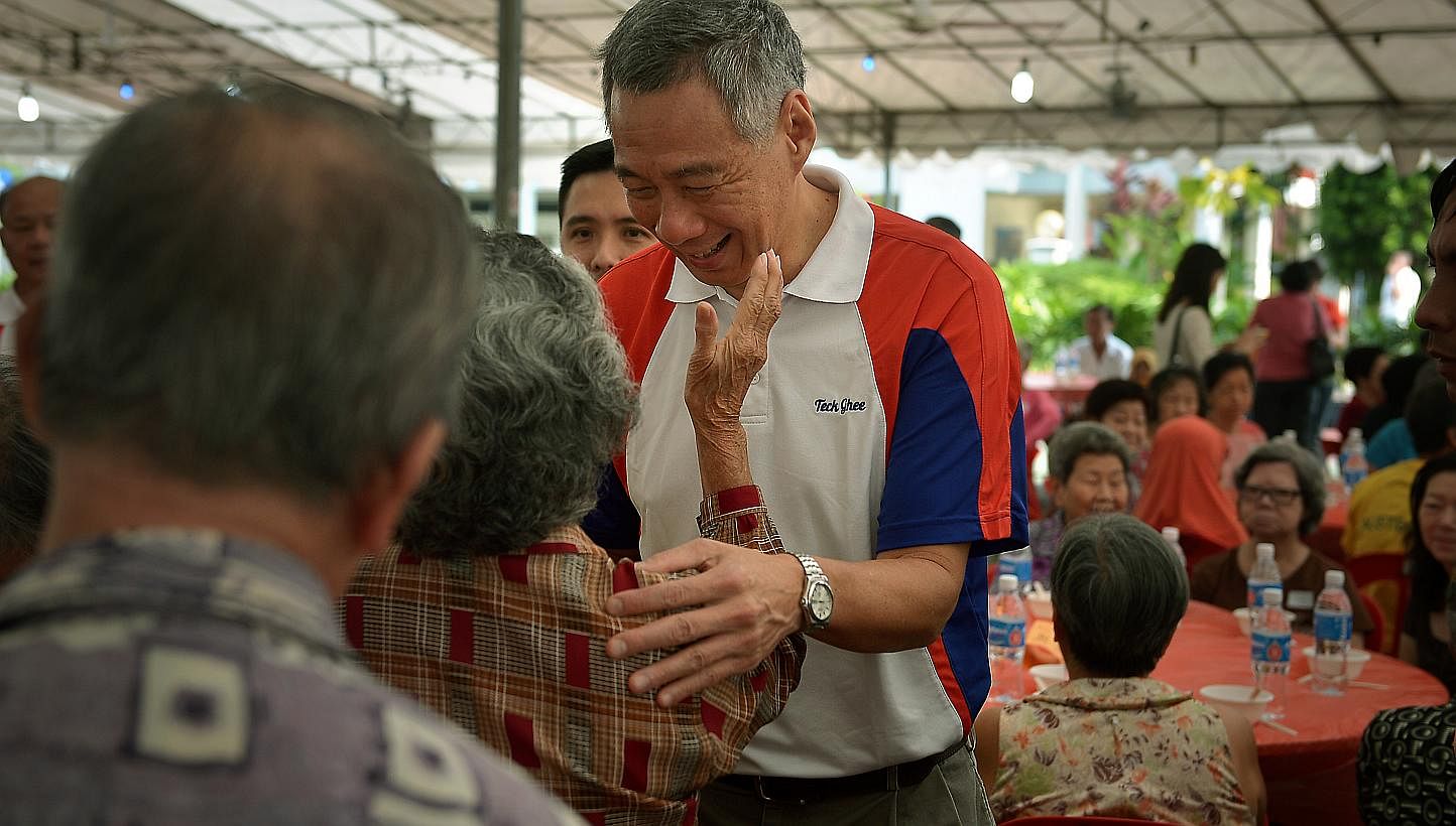 PM Lee Hsien Loong meeting elderly residents at the Teck Ghee Division Hongbao Presentation Ceremony 2015. As generations of family members gather for their Chinese New Year reunion feast on Wednesday, Mr Lee urged Singaporeans not to overlook the im