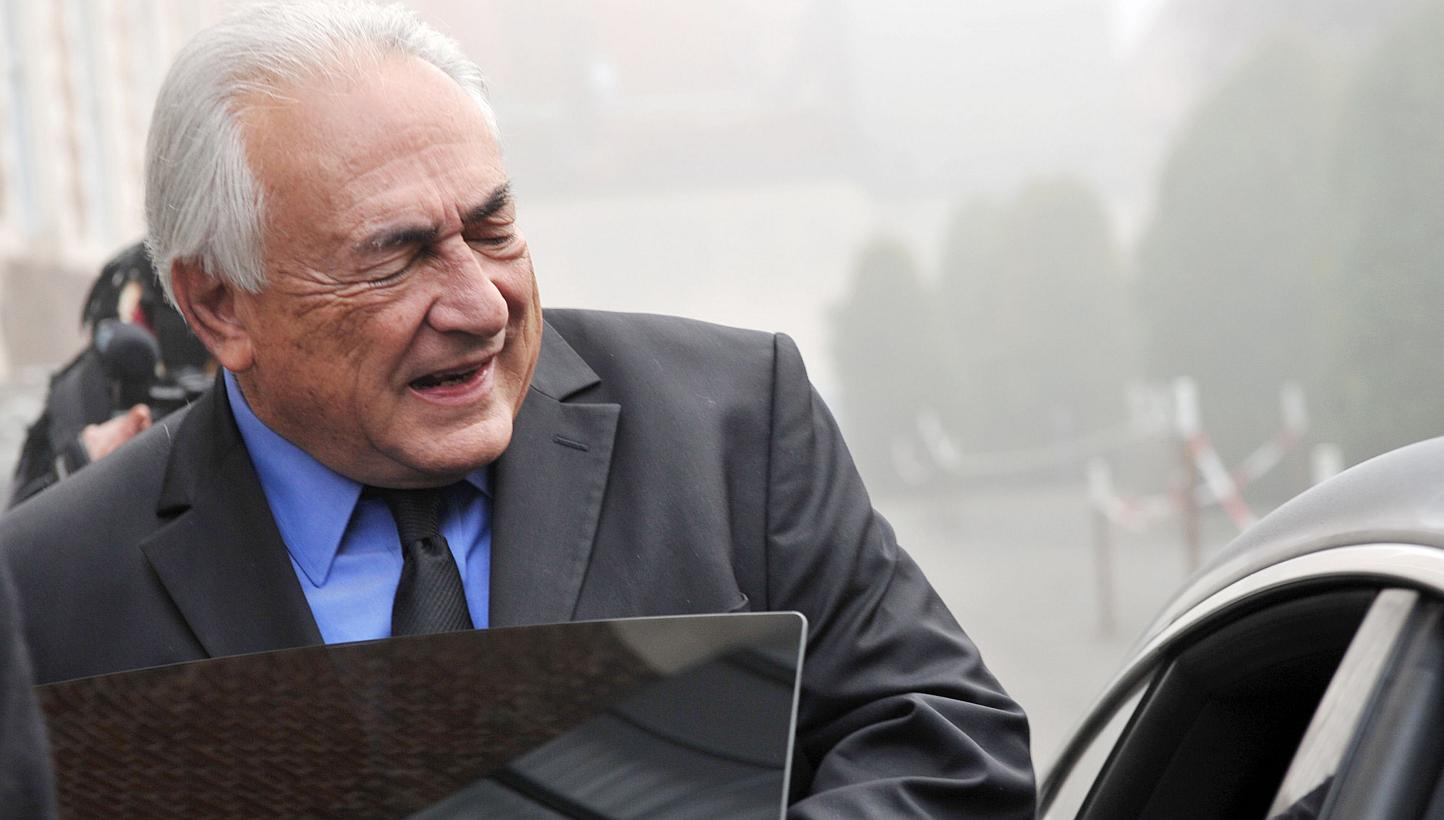 Former IMF chief Dominique Strauss-Kahn enters his car after leaving his hotel on Monday in the northern French city of Lille to attend a session on the third week of the so-called "Lille Carlton Hotel Case" trial. -- PHOTO: AFP