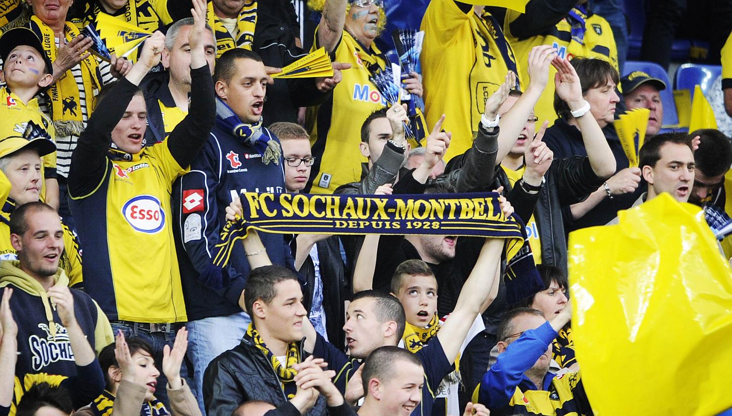 Sochaux-Montbeliard 's football team supporters holding a scarf reading "FC Sochaux Montbeliard, since 1928" during a football match between Sochaux and Evian at the Auguste Bonal stadium in Montbeliard last year. -- PHOTO: AFP