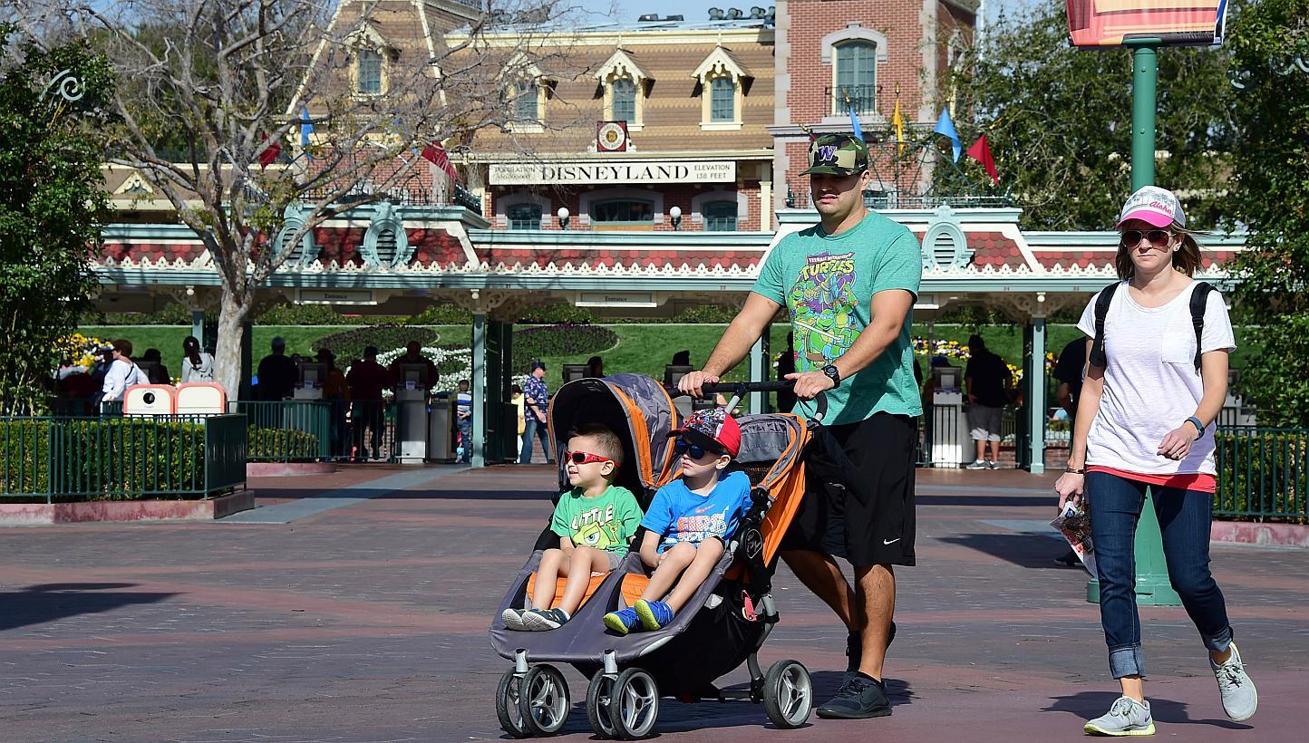 A family visitng Disneyland on Jan 22, 2015, in Anaheim, California. -- PHOTO: AFP