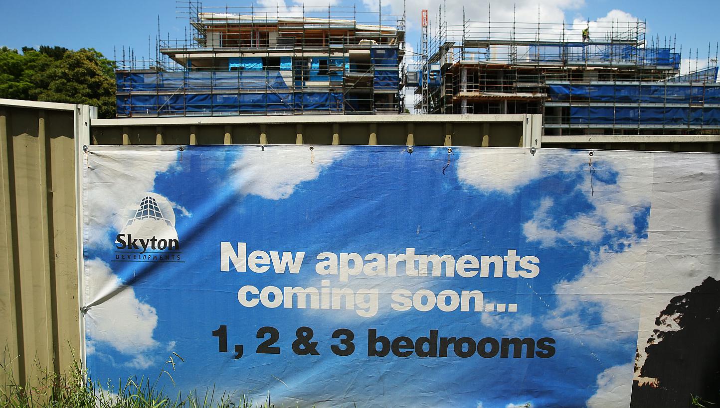 An advertisement for a residential project is displayed at a construction site in Sydney on Jan 24, 2015. Australia plans to charge fees to foreigners buying residential property in an attempt to improve housing affordability. -- PHOTO: BLOOMBERG