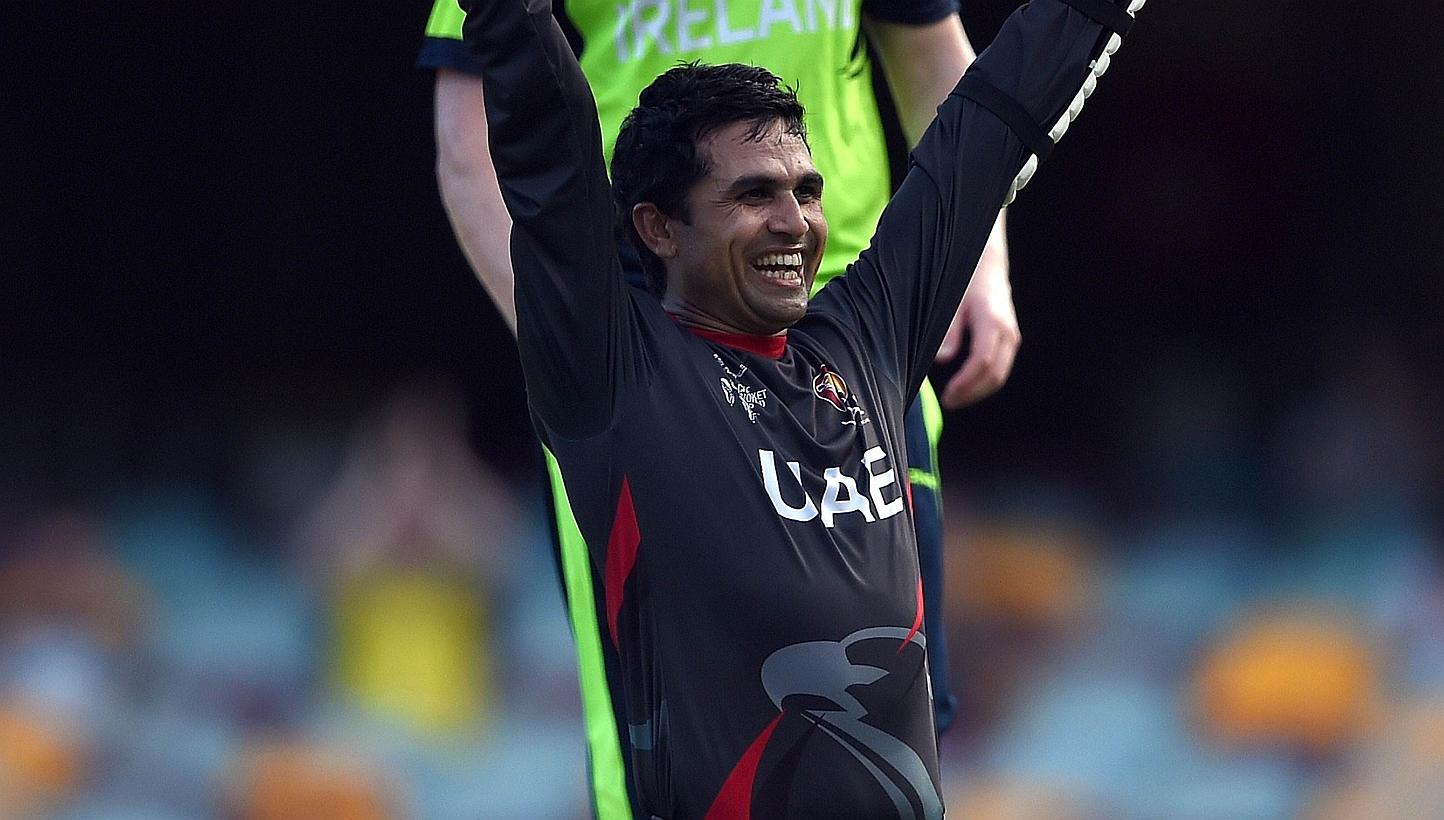 United Arab Emirates (UAE) batsman Shaiman Anwar celebrates after scoring his century during the 2015 Cricket World Cup Pool B match between Ireland and UAE at the Gabba cricket stadium in Brisbane on Feb 25, 2015. -- PHOTO: AFP