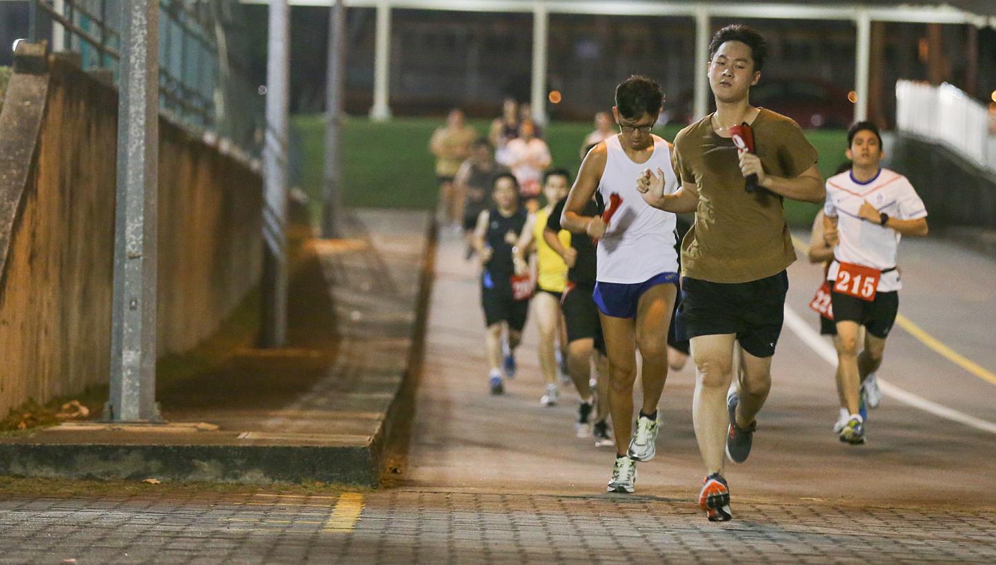 Operationally ready national servicemen (NSmen) running as part of IPPT Preparatory Training (IPT) programme in Maju Camp on Sept 8, 2014. -- ST PHOTO: ONG WEE JIN