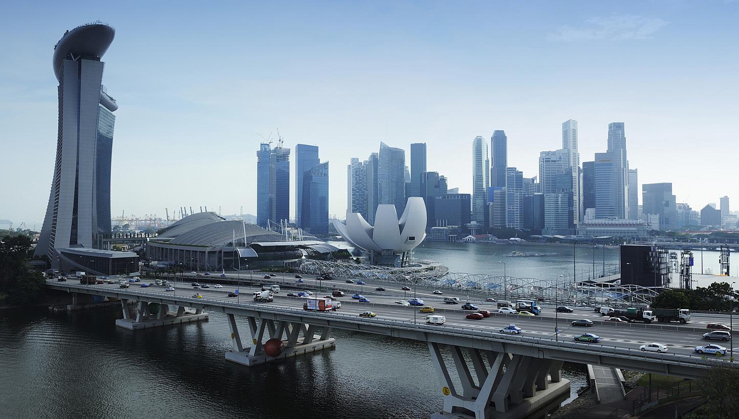 Singapore's Budget 2015 announcement on higher tax allowances for mergers and acquisitions is heartening. It is now easier for SMEs to gain opportunities for significant inorganic growth. -- PHOTO: BLOOMBERG