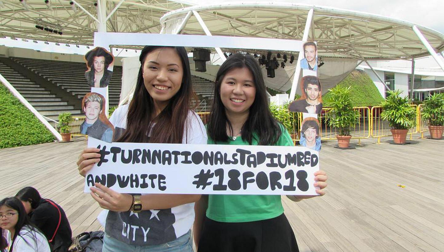 One Direction fans Leong Xinyi (right) and Desiree Choo (left) plan to put on a coordinated light spectacle for the upcoming concert. -- PHOTO: DESIREE CHOO