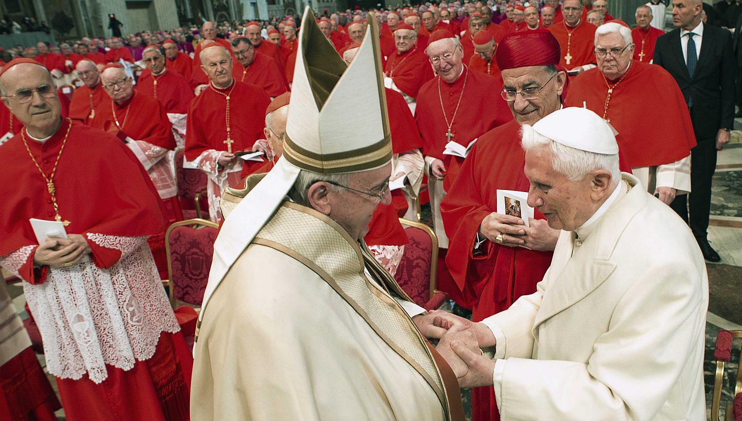 Pope Francis (left) greeting Emeritus Pope Benedict XVI at the Vatican on Feb 14, 2015. -- PHOTO: REUTERS