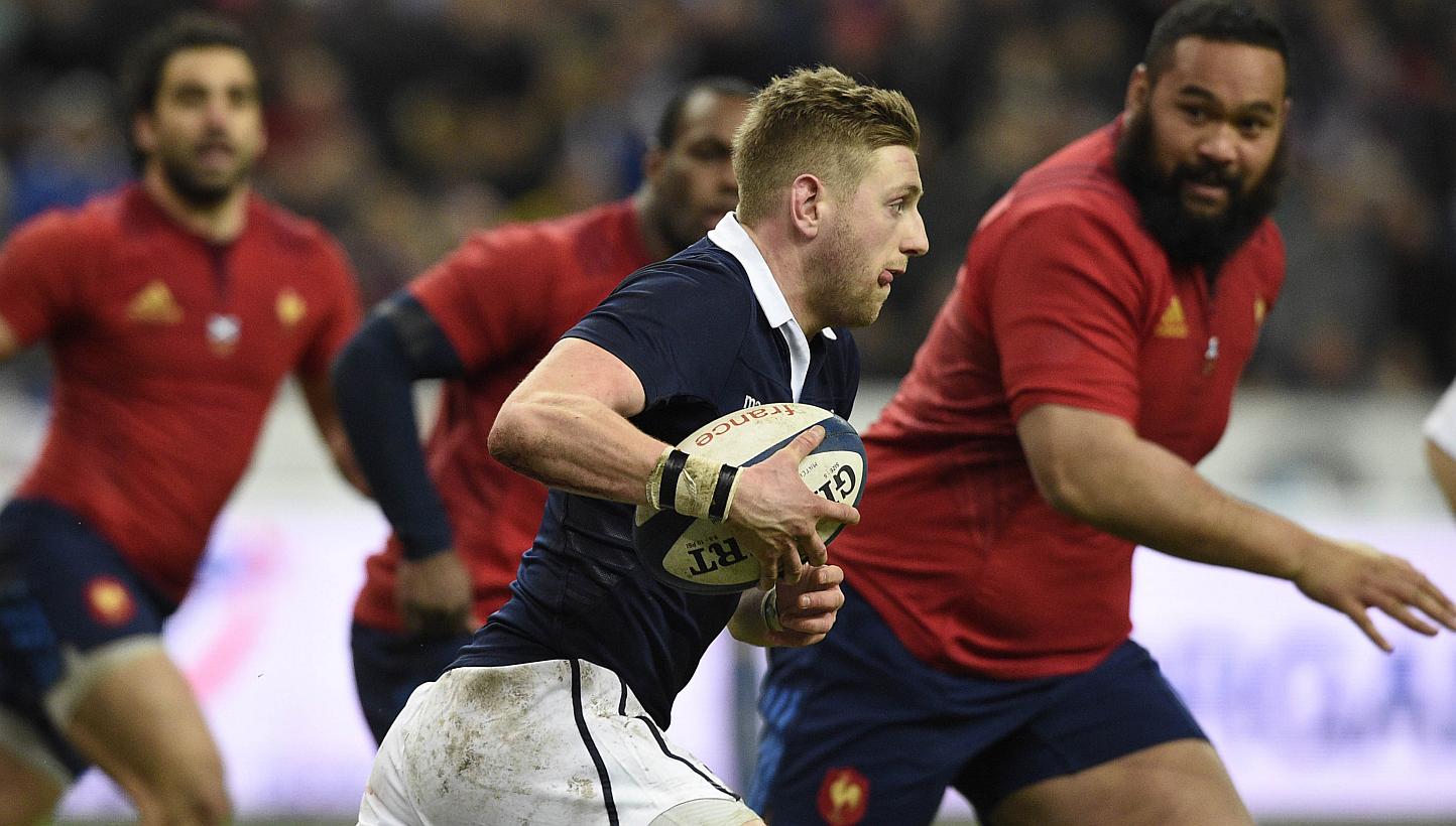 Scotland's fly-half Finn Russell runs with the ball during the Six Nations international rugby union match between France and Scotland, at the Stade de France, northern Paris on Feb 7, 2015. -- PHOTO: AFP