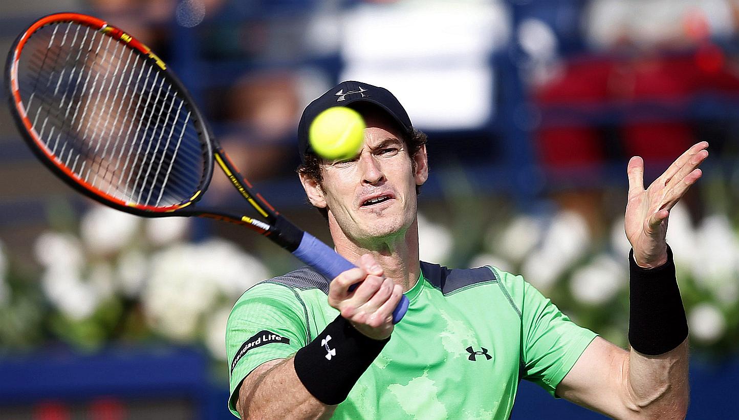Britain's Andy Murray returns the ball to Croatia's Borna Coric during their quarter final match of the Dubai Duty Free Tennis ATP Championships in Dubai, United Arab Emirates on Feb 26, 2015. -- PHOTO: EPA 