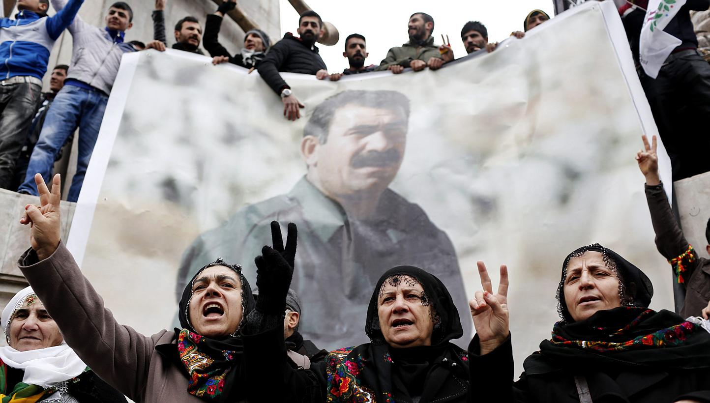 Supporters of the Kurdistan Workers' Party (PKK) imprisoned PKK leader Abdullah Ocalan who has been held in detention by Turkey for 16 years. The jailed leader has urged PKK to lay down their arms. -- PHOTO: EPA