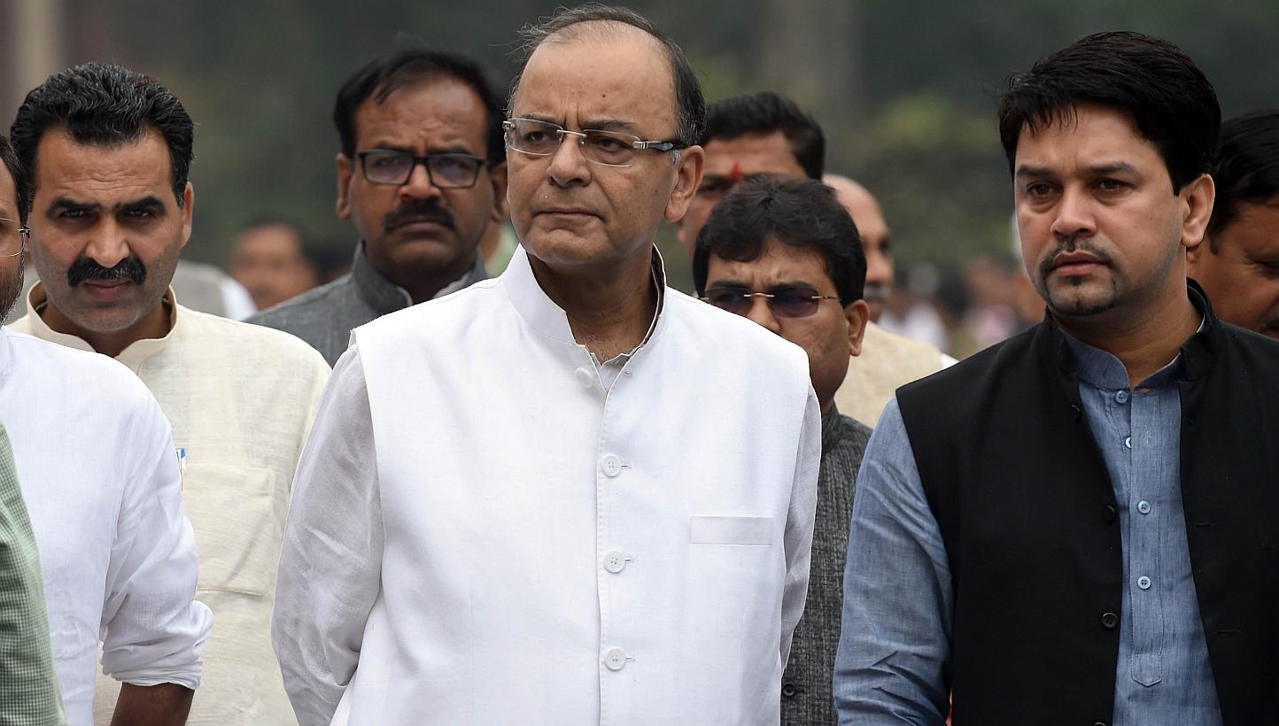 Indian Finance Minister Arun Jaitley walks with party officials and Members of Parliament after a Bharatiya Janata Party (BJP) Parliamentary Board meeting at Parliament House in New Delhi on Feb 24, 2015. -- PHOTO: AFP