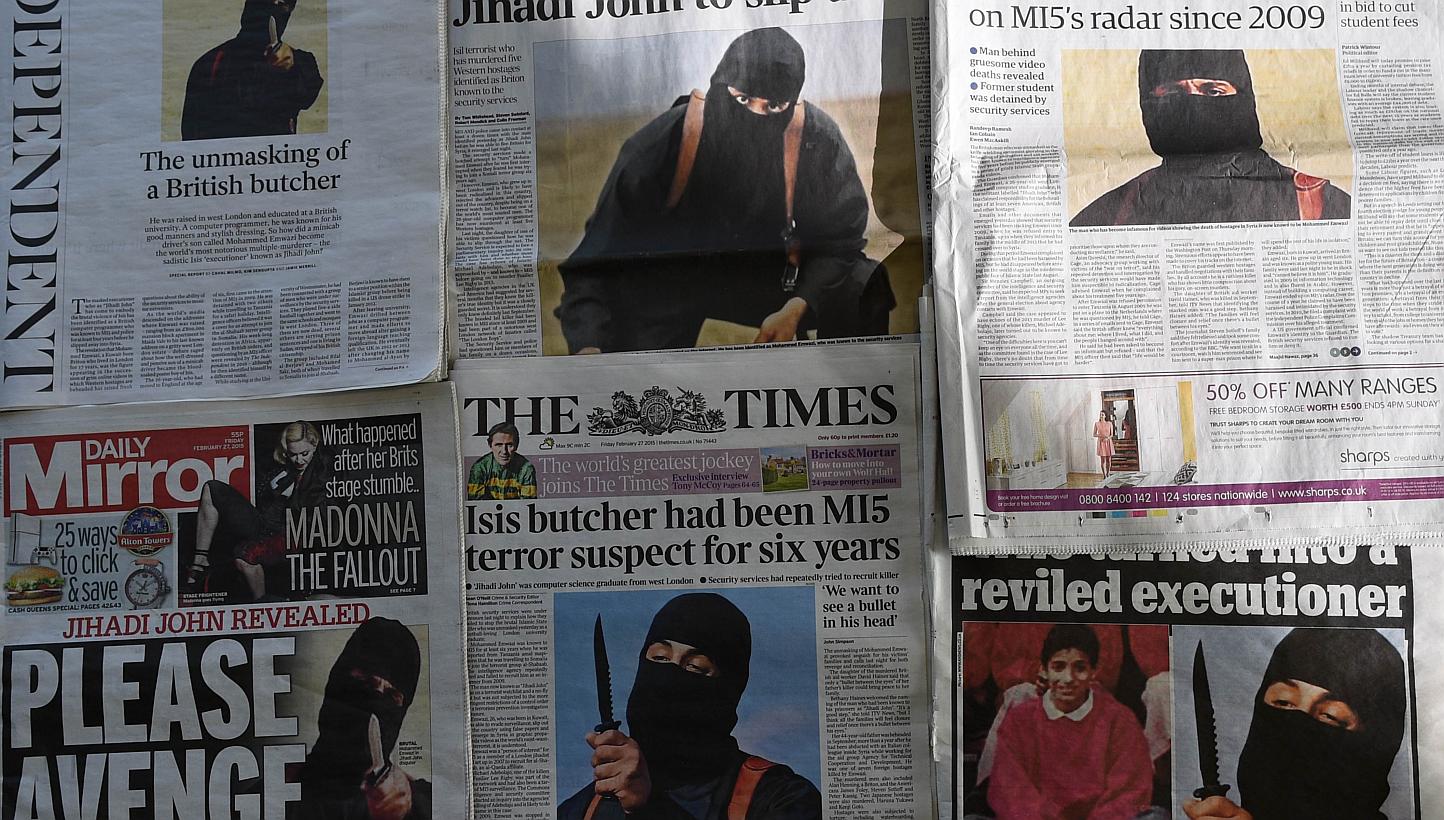 An arrangment of British daily newspapers photographed in London on Feb 27, 2015 shows the front-page headlines and stories regarding the identification of the masked Islamic State group militant dubbed "Jihadi John". -- PHOTO: AFP