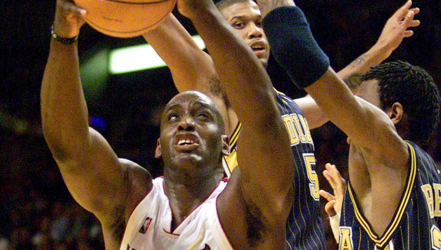 Miami Heat forward Anthony Mason (left) attempts to shoot around the defensive pressure of Indiana Pacers guard Jalen Rose (centre) and forward Jonathan Bender (right) during the second quarter of NBA play in Miami, Florida in this file photo from Fe