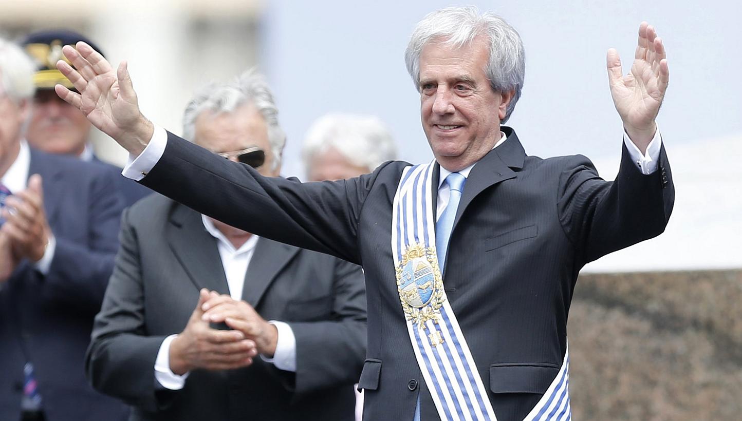 Uruguay's new president Tabare Vazquez gesturing after receiving the presidential sash from his predecessor, Jose Mujica (left, partially obscured) in Montevideo on March 1, 2015. -- PHOTO: REUTERS