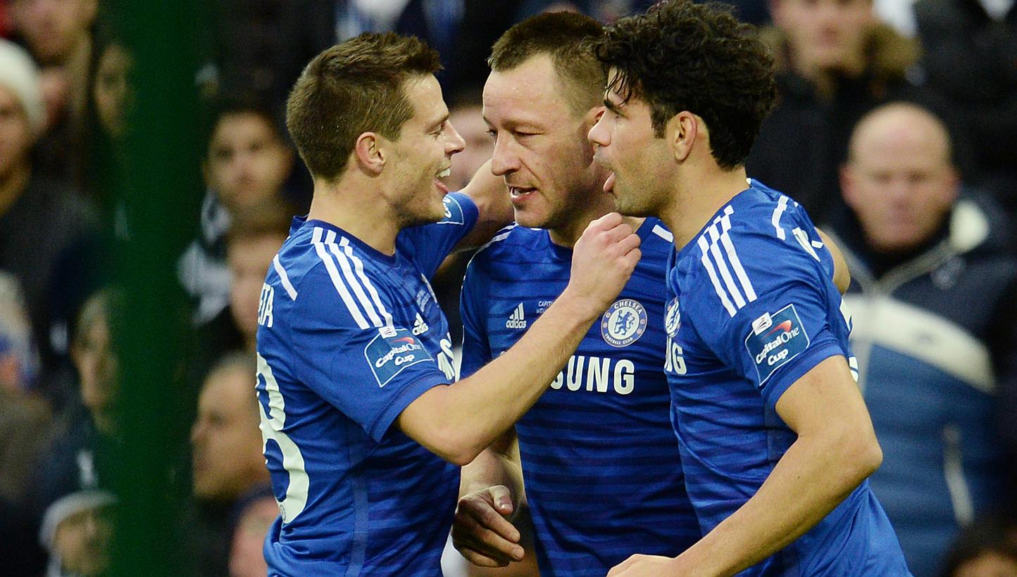Chelsea players celebrate after team mate John Terry (centre) scored for Chelsea against Tottenham during the Capital One cup final at Wembley in London Sunday. -- PHOTO: EPA