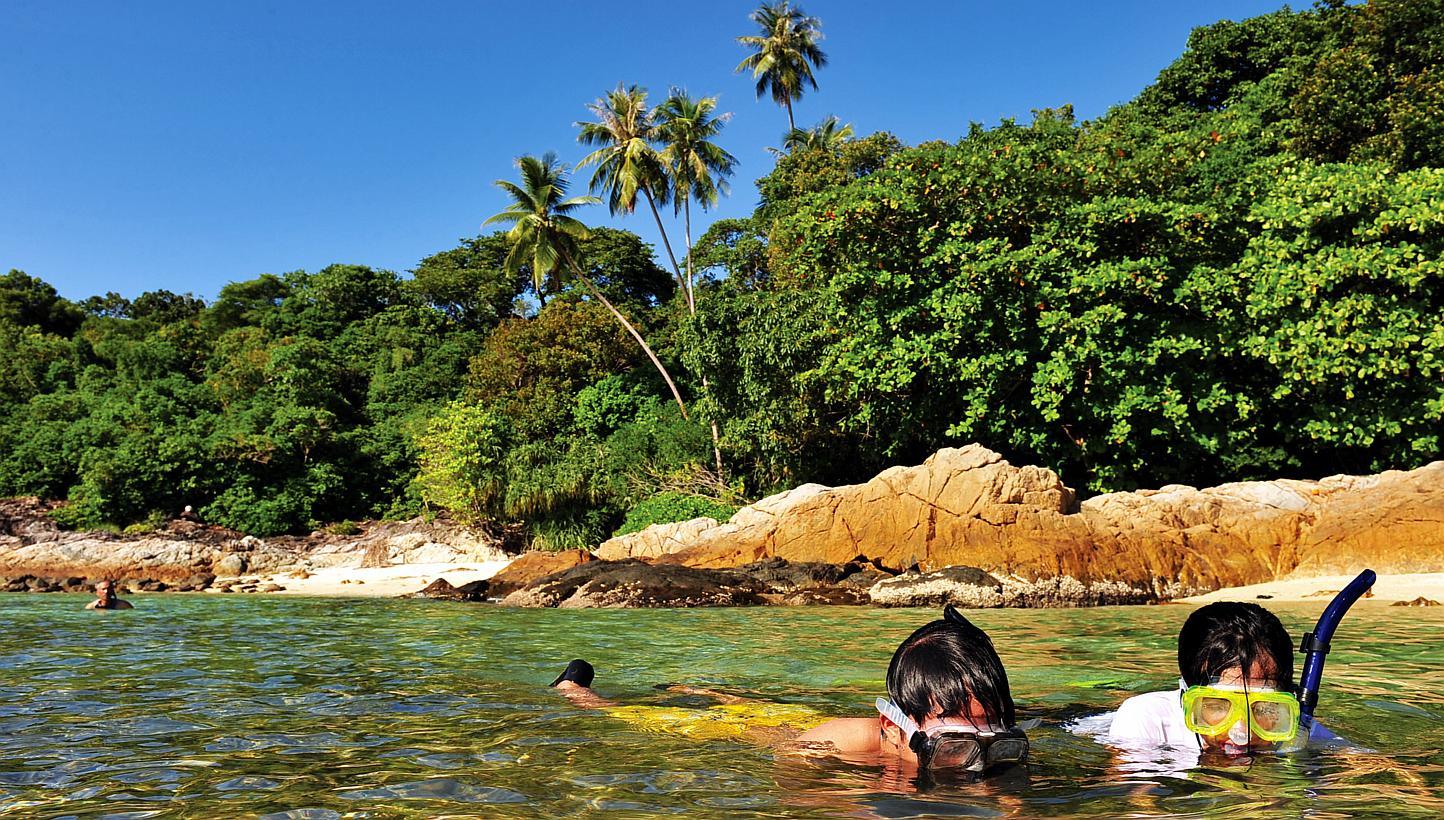 Tourists snokelling at Pulau Perhentian in Terengganu, Malaysia. Authorities in the Malaysian state of Terengganu on Sunday said they would soon impose a dress code on female tourists as outlined by the state government. Now, it appears, however