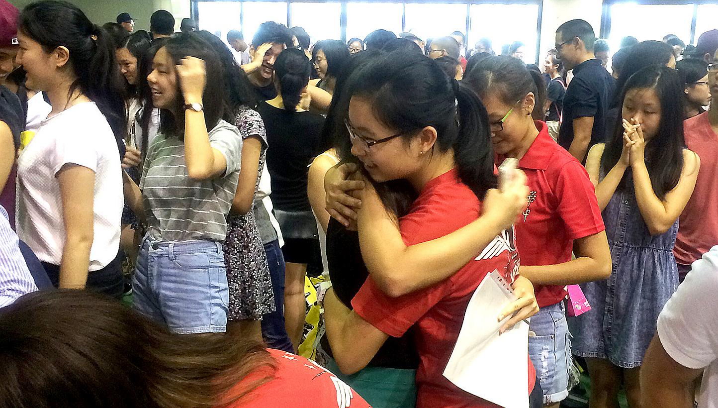 Hwa Chong Institution students received their A level results in their school hall on March 2, 2015. About 91.4 per cent of the 14,185 students who took last year's GCE A-level examination scored at least three H2 passes, with a pass in General Paper