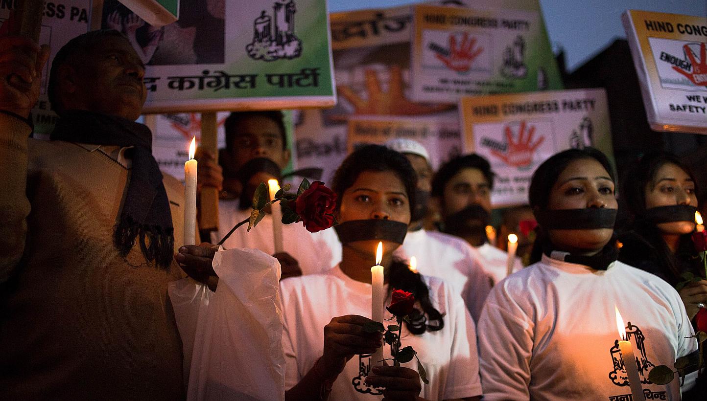 Indian political and civil society activists take part in a vigil to mark the second anniversary of the fatal gang-rape of a student in the Indian capital, at the bus stop in the Munirka area of New Delhi on Dec 16, 2014.&nbsp;One of the men convicte