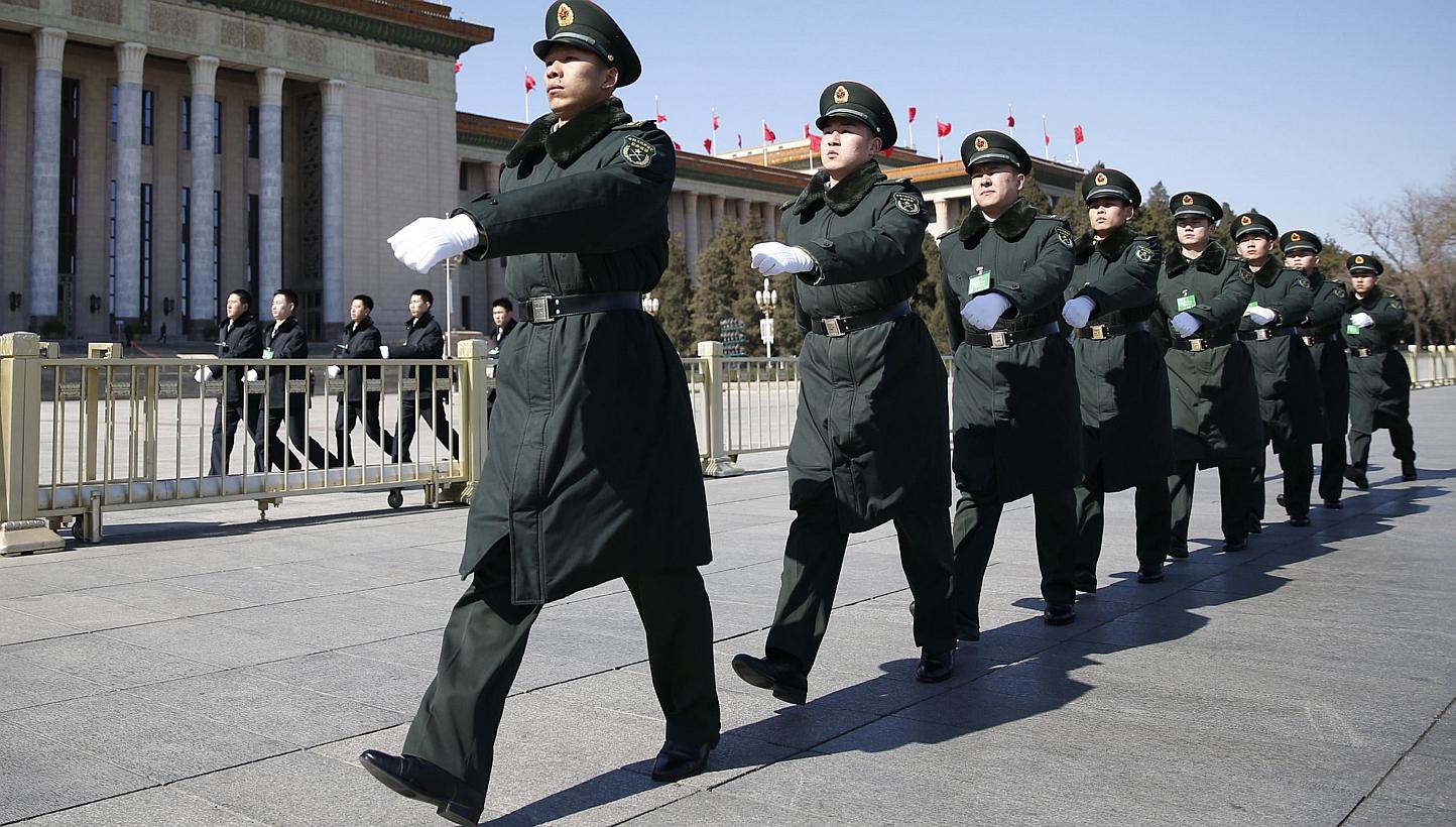 Soldiers from China's People's Liberation Army (PLA) march ahead of the opening session of Chinese People's Political Consultative Conference (CPPCC) at Tiananmen Sqaure in Beijing on March 3, 2015.&nbsp;China will hold a military parade to mark the 
