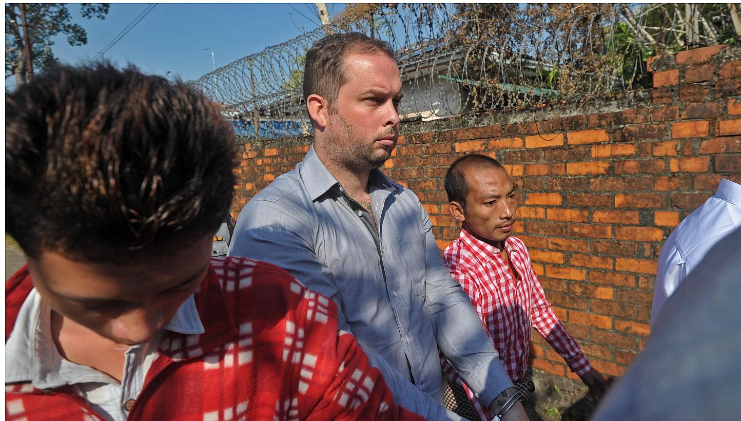 Philip Blackwood (centre) arrives for his hearing at a court in Yangon on Dec 18, 2014. -- PHOTO: AFP&nbsp;