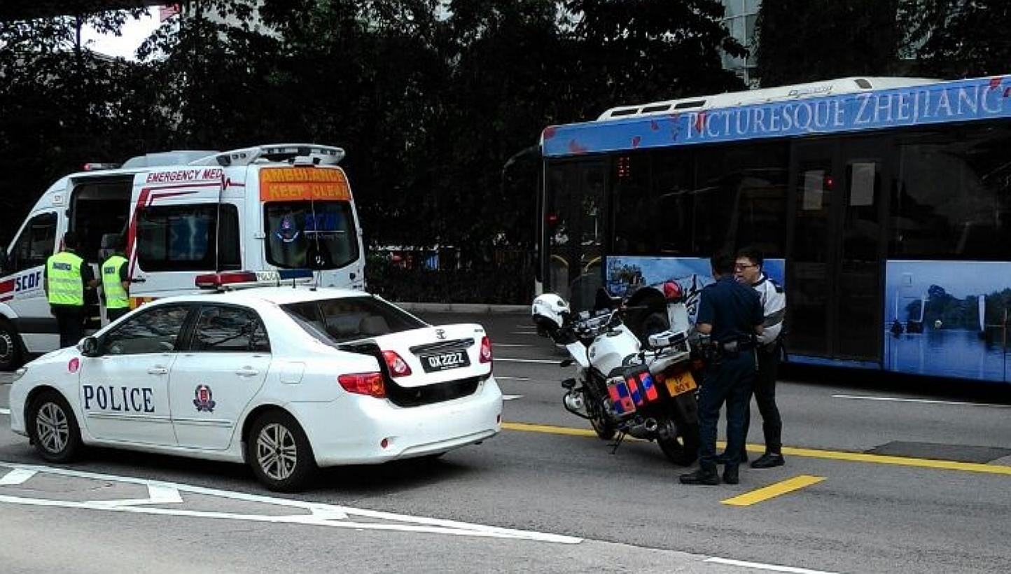 A 25-year-old Vietnamese woman is believed to have fallen from West Coast Highway and landed on Telok Blangah Road on Tuesday afternoon. -- PHOTO: COURTESY OF A COMMUTER AT THE SCENE