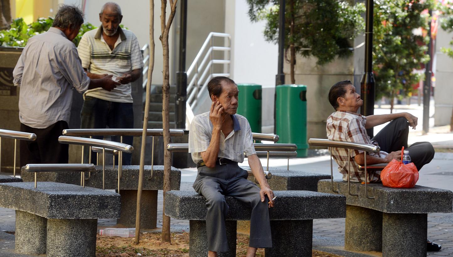 Elderly men elderly sitting around at Chinatown. MPs on Tuesday commented on the "leftwards" shift they saw in Budget 2015, which introduced more social safety nets and other measures to mitigate inequality in society. -- ST PHOTO: AZIZ HUSSIN&nbsp;