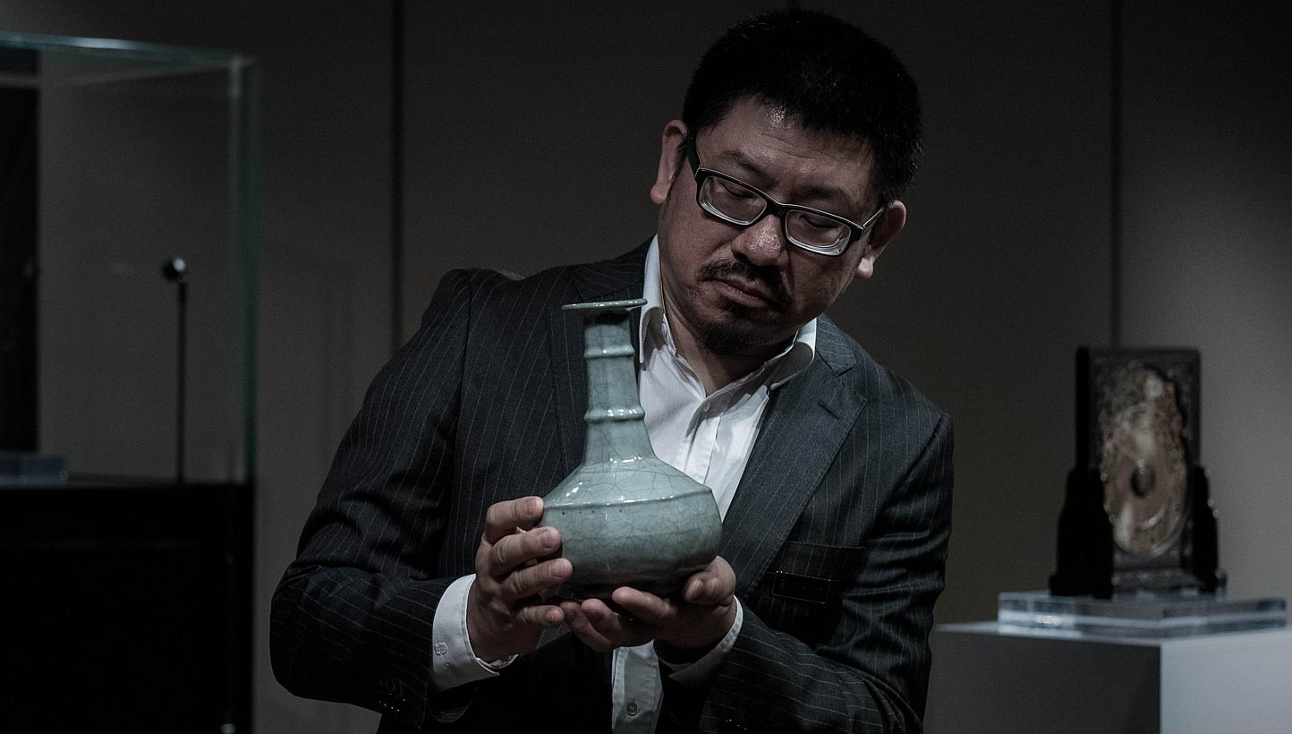 A Chinese Guan Vase of the Southern Song Dynasty is shown to the media in Hong Kong on Monday. The rare vase is expected to fetch more than 60 million HKD &nbsp;at Sotheby’s Hong Kong Chinese Works of Art Spring Sales 2015 which will take place on 