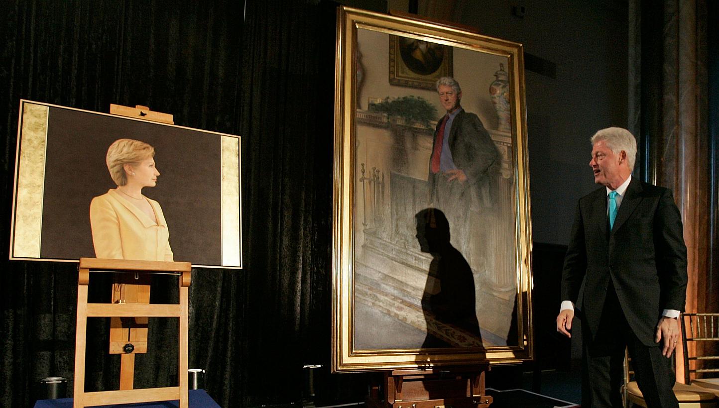 This April 24, 2006 file photo shows former US President Bill Clinton looking at his and his wife Hillary Clinton's portraits during an unveiling ceremony at the Smithsonian in Washington, DC. Mr Clinton's portrait, now in the National Portrait Galle