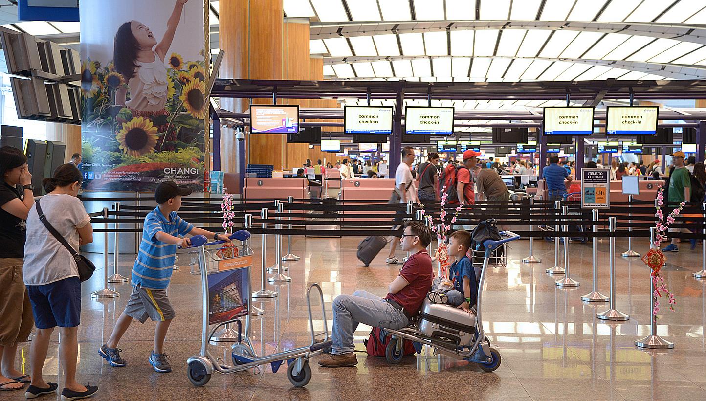 Passengers in Changi Airport's Terminal 2. The new&nbsp;Terminal 5 is likely to comprise a main facility linked to one or more satellite terminals via an underground rail link. -- PHOTO:&nbsp;LIM SIN THAI