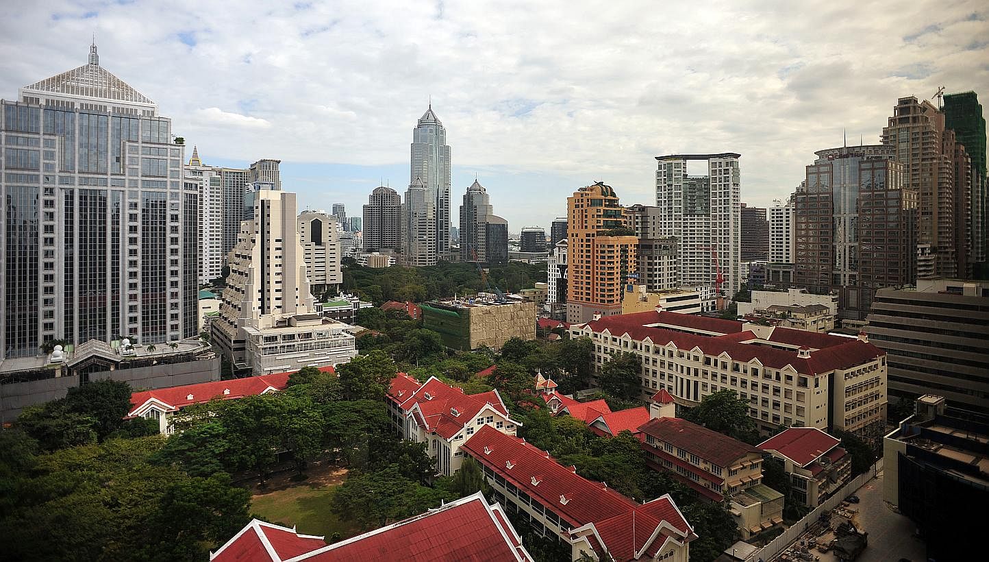 Skyline of Bangkok, Thailand. The Land of Smiles has lived up to its moniker and received the lowest score on the misery index, and therefore the top spot on Bloomberg's happiest list. -- PHOTO: ST FILE&nbsp;