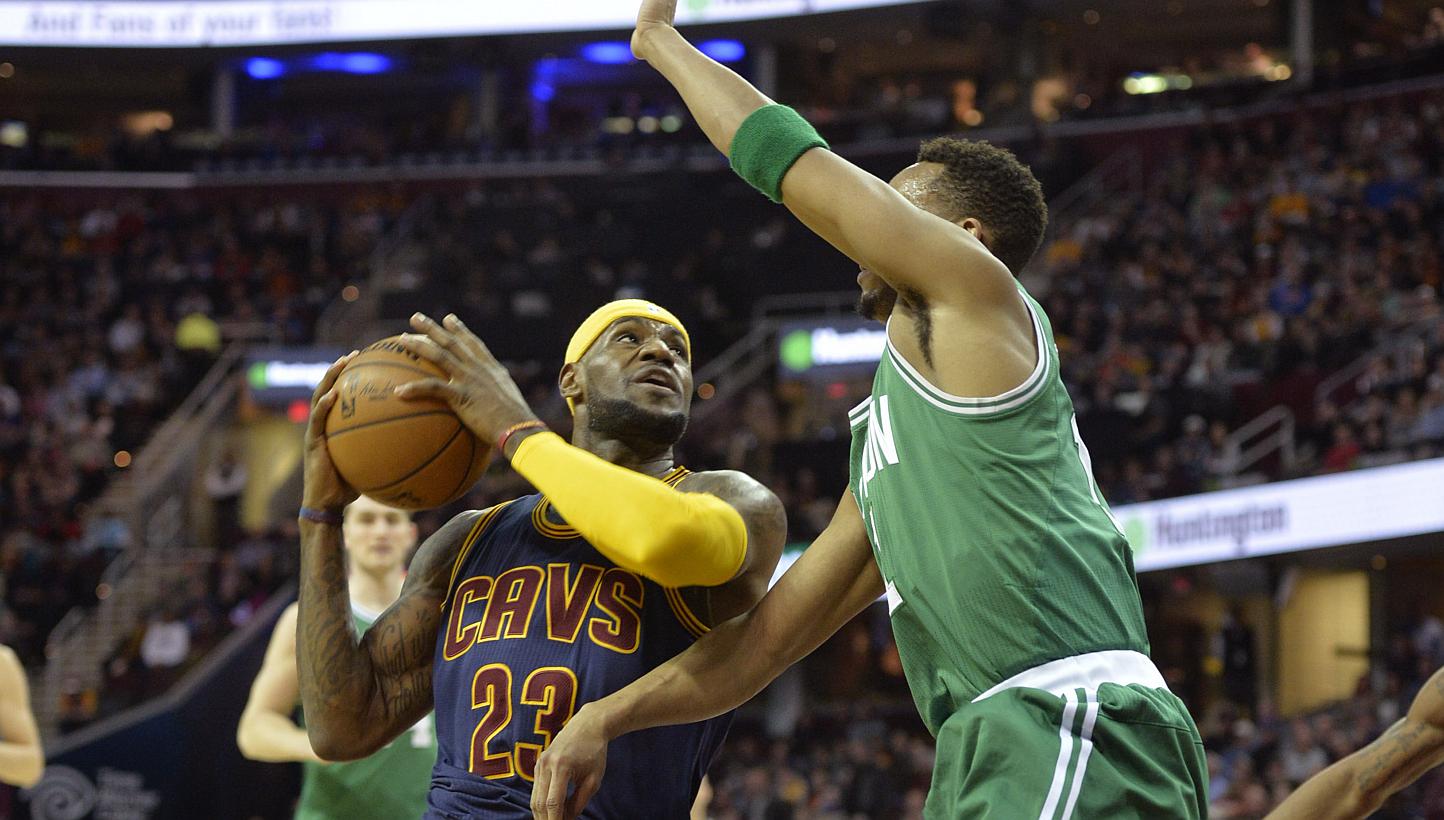 Cleveland Cavaliers forward LeBron James (#23) drives against Boston Celtics guard Evan Turner (#11) in the first quarter at the Quicken Loans Arena in Cleveland, Ohio, on March 3, 2015. -- PHOTO: DAVID RICHARD - USA TODAY SPORTS