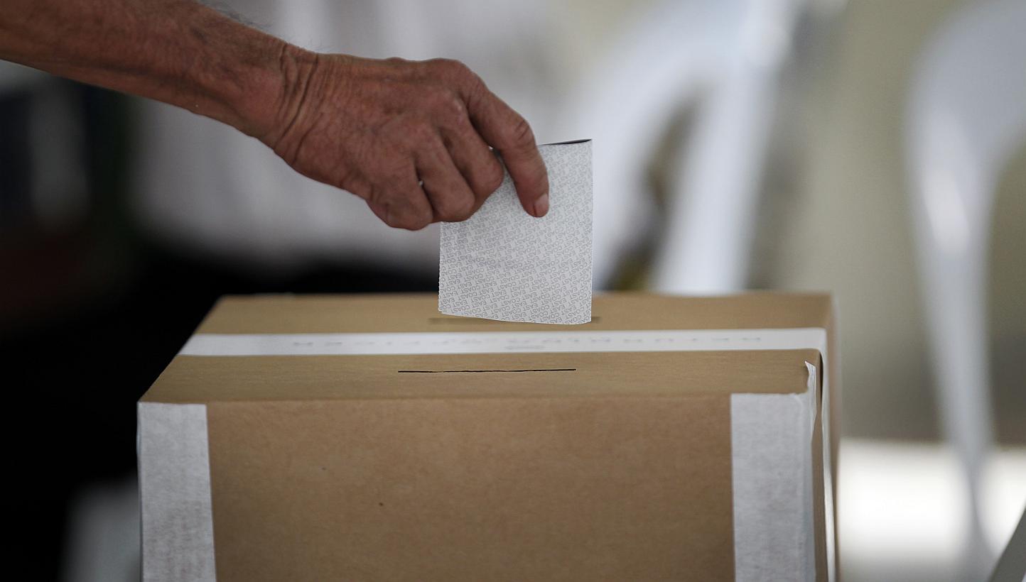 A voter casting his ballot in the 2011 General Election. Singapore citizens who have yet to check their particulars in the revised registers of electors are reminded to do so by March 9, 2015. -- PHOTO: ST FILE