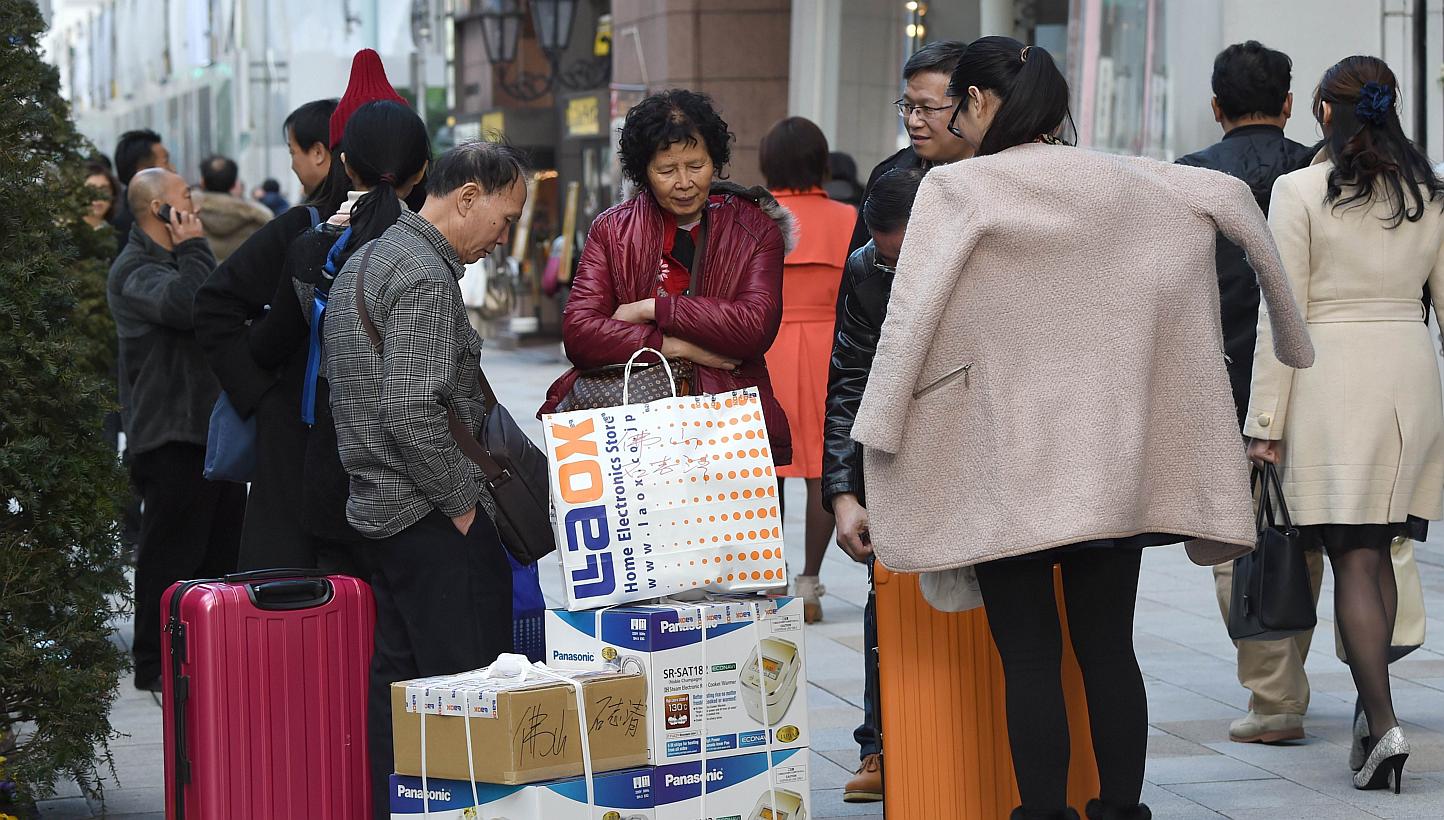 Tourists in Tokyo on Feb 6, 2015. &nbsp;Japan's tourism sector is shattering expectations on visitor numbers, largely owing to a weak yen and fading fears about the fallout from the Fukushima disaster. -- PHOTO: AFP