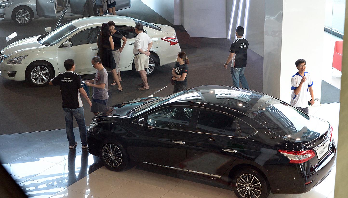 Certificates of entitlement (COE) for cars rose across the board at the latest tender on Wednesday as buyers flocked to showrooms ahead of a revised carbon emissions scheme and higher prices. -- ST PHOTO: DESMOND WEE
