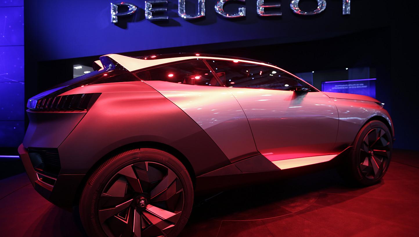 A Peugeot Quartz concept automobile, produced by PSA Peugeot Citroen, stands on display ahead of the 85th Geneva International Motor Show in Switzerland. The show opens to the public on Thursday. -- PHOTO: BLOOMBERG