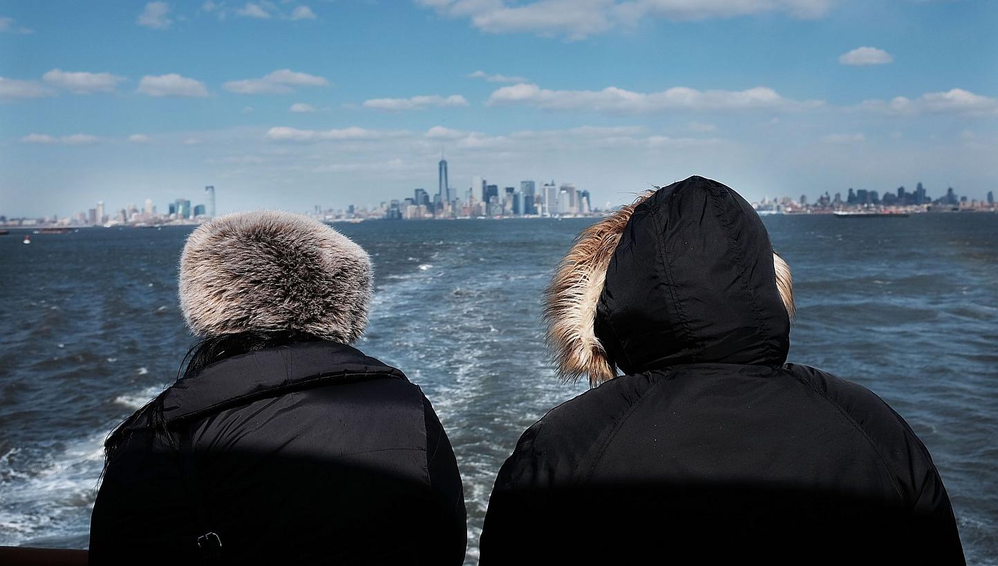 The New York skyline as seen from the Staten Island ferry on Feb 19, 2015.&nbsp;Rent will gobble up nearly 60 per cent of New Yorkers' income in 2015 with the median cost of an apartment to rise to US$2,700 (S$3,680) a month, a real-estate website sa