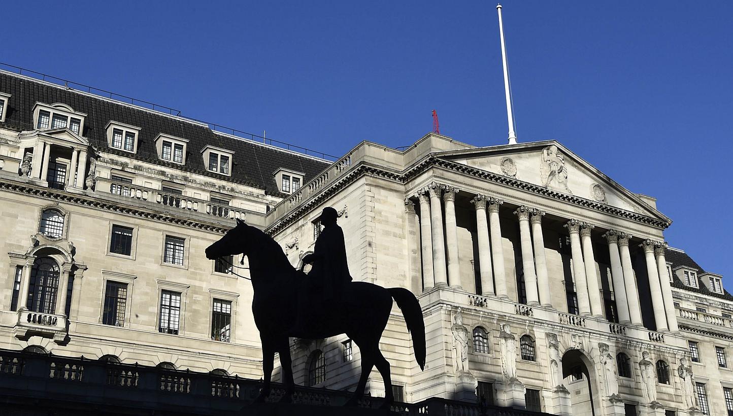 The Bank of England, seen with a statue in the foreground, in London on Dec 16, 2014. -- PHOTO: REUTERS