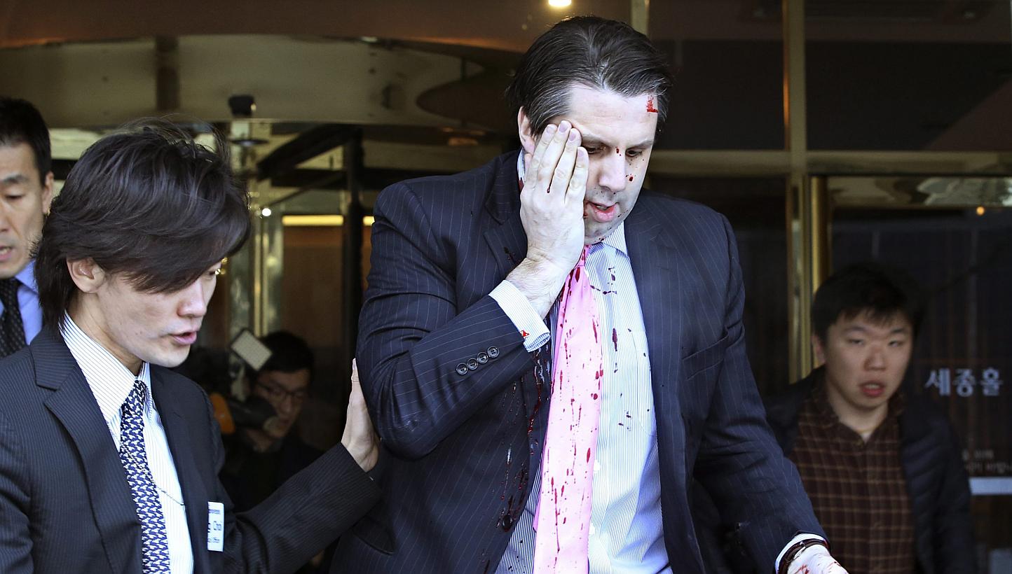 US Ambassador to South Korea Mark Lippert leaving Sejong Centre for Performing Arts in downtown Seoul on March 5, 2015, after being attacked by a knife-wielding assailant. -- PHOTO: EPA