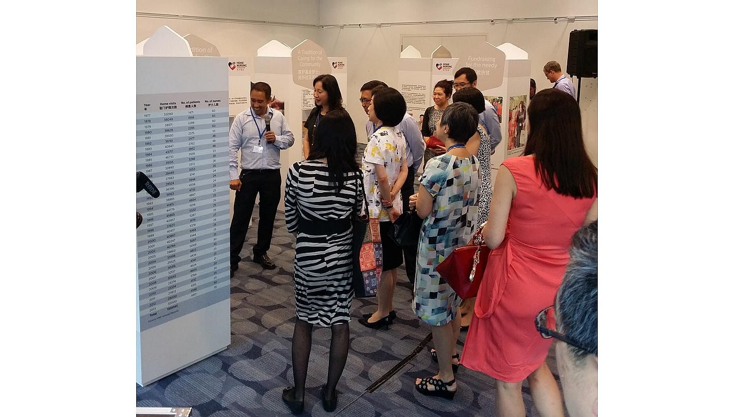 Visitors looking at the displays at the Home Nursing Foundation's first-ever travelling exhibition commemorating its past, at the Central Public Library on Thursday, March 5, 2015. The exhibition was done in partnership with the National Library Boar