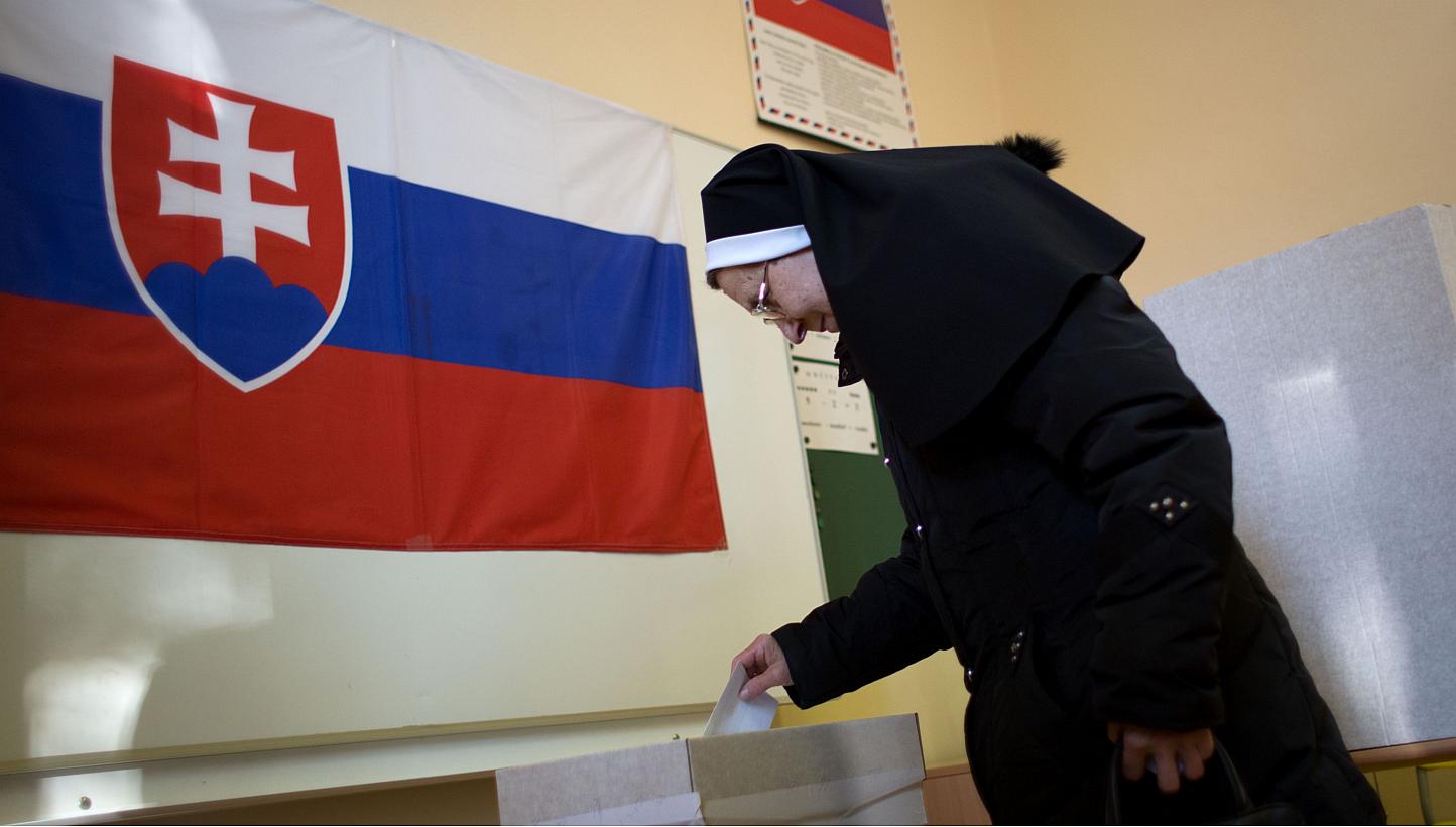 A woman casting her ballot during a referendum about same-sex marriage, a ban on gay and lesbian couples from adopting and sex education classes in schools, in Slovakia on Feb 7, 2015. Globalisation has served to curtail rather than expand school-bas