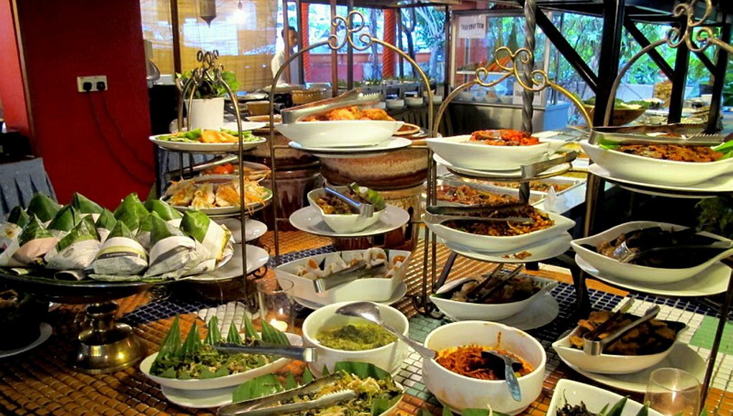 Malaysia has a thriving food scene as diverse as Singapore's but none of its restaurants has made the cut. That is inexplicable. Above, a buffet spread at Rebung Restaurant in Kuala Lumpur.