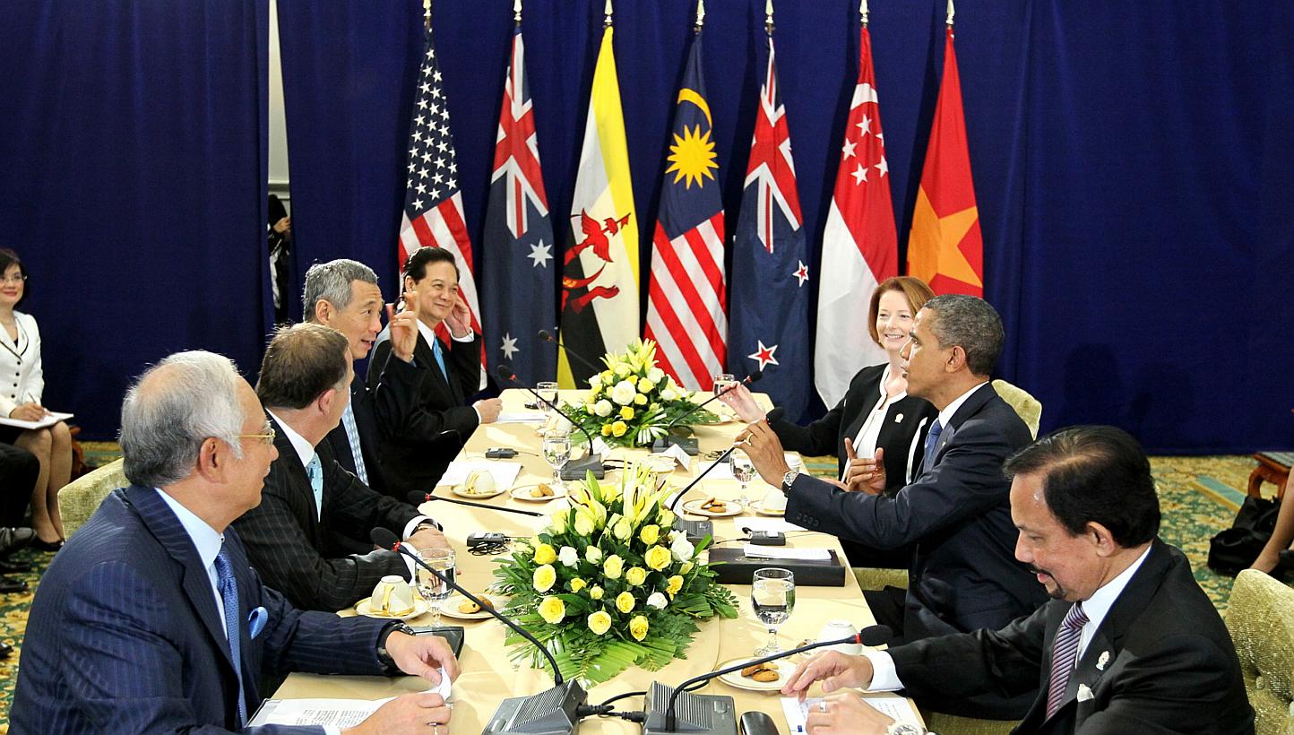 A 2012 photo from Singapore Prime Minister Lee Hsien Loong’s Facebook page shows Asia-Pacific leaders in Cambodia discussing the Trans-Pacific Partnership with US President Barack Obama (second from right). -- PHOTO: MINISTRY OF COMMUNICATIONS AND 