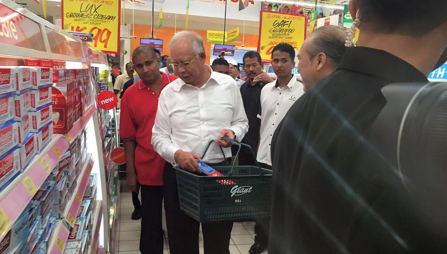 Malaysian Prime Minister Najib Razak went shopping in a supermarket on the first day the country implemented a 6 per cent consumption tax aimed at plugging a leaky tax-collection system. -- PHOTO: NAJIB RAZAK'S FACEBOOK&nbsp;