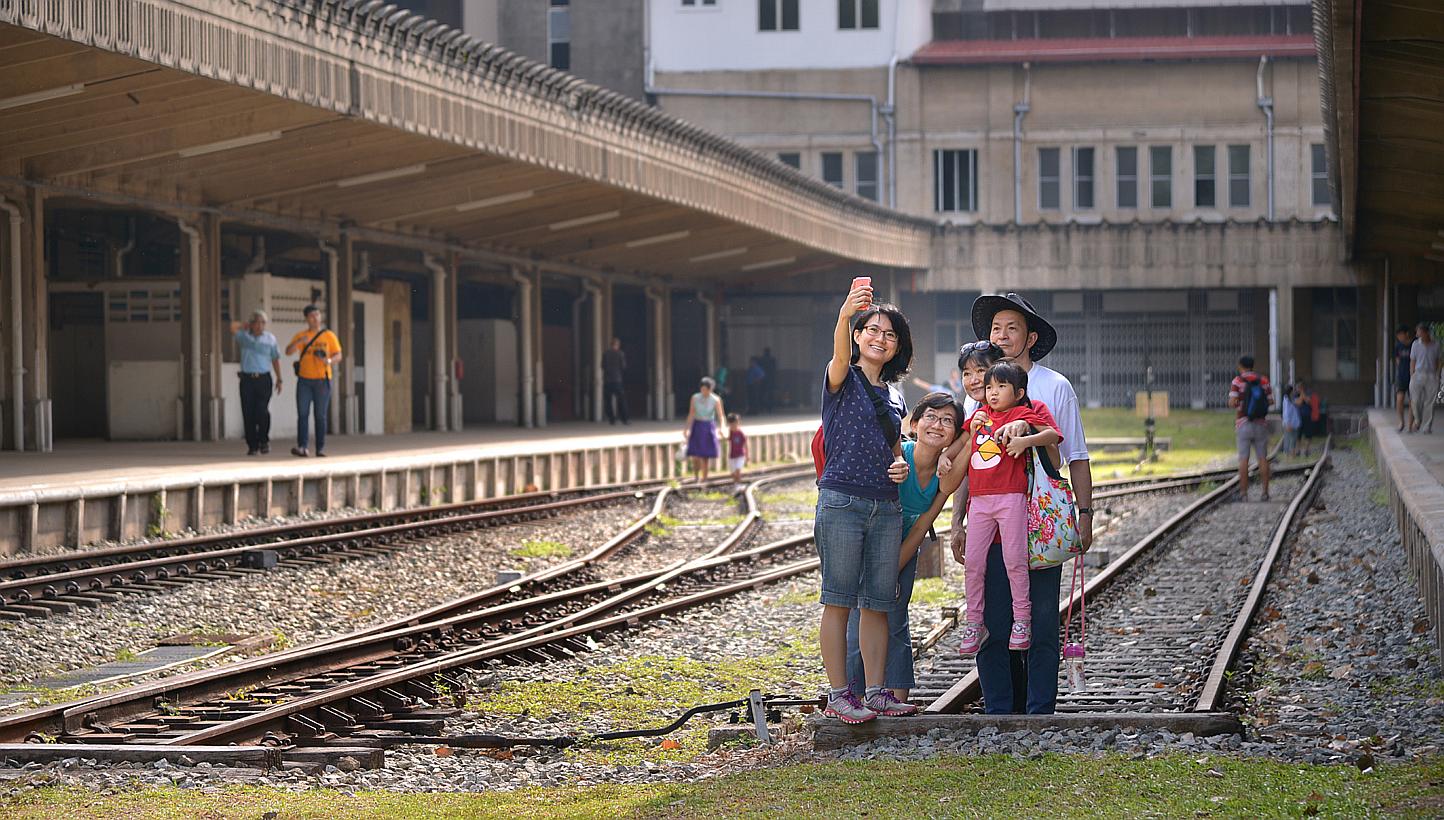 Visitors taking a picture of themselves at the former Tanjong Pagar Railway Station. It will open its doors to the public on Good Friday from 9am to 6pm. -- ST PHOTO: LIM SIN THAI