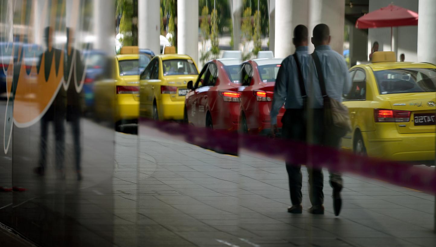 Once changes are approved, all 28,000 cabs on the road will have to charge the same peak-period, location, city, and midnight surcharge rates. -- ST PHOTO: KUA CHEE SIONG