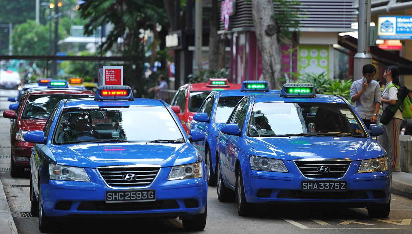 The Public Transport Council (PTC) has responded to concerns that taxi firms might violate the Competition Act by coming together to set the same taxi surcharges. -- ST PHOTO: LIM YAOHUI FOR THE STRAITS TIMES 