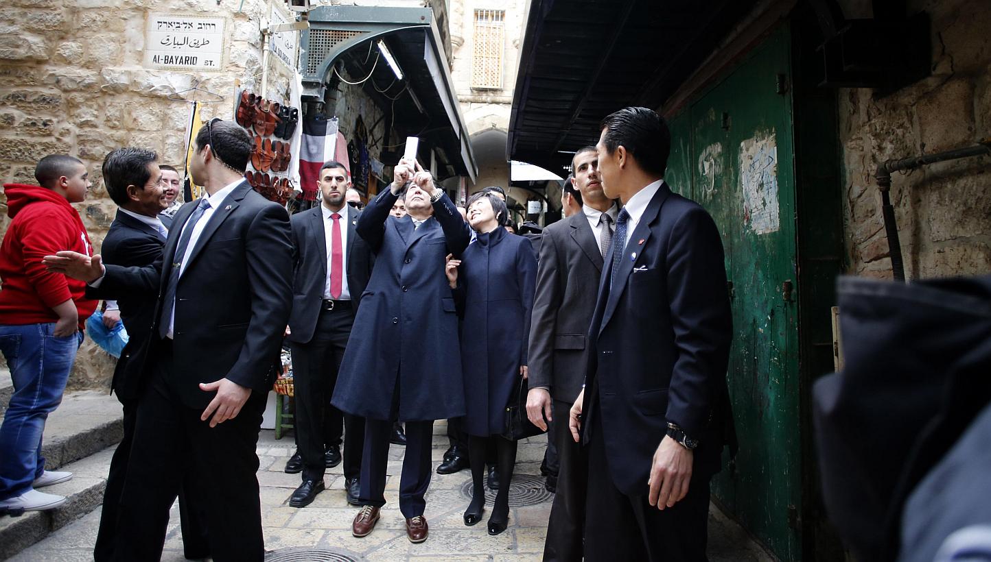 Japanese Prime Minister Shinzo Abe (middle) taking a selfie with his wife Akie during a visit to the Old City of Jerusalem on Jan 19, 2015. Mr Abe's party is offering a chance for people to take selfies with the premier by installing a "puri-kura" (p